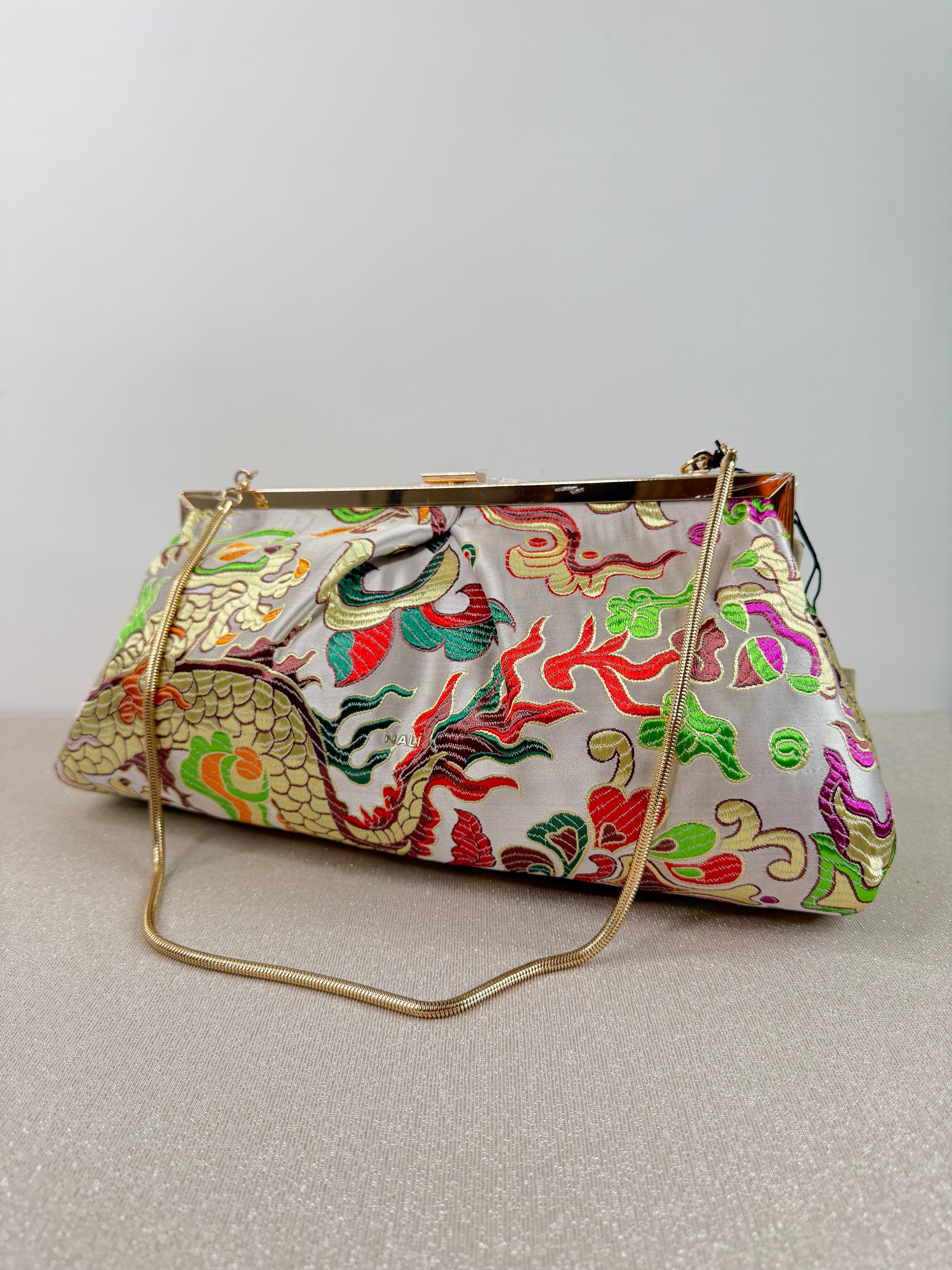 Pochette elegante ricamata con tracolla