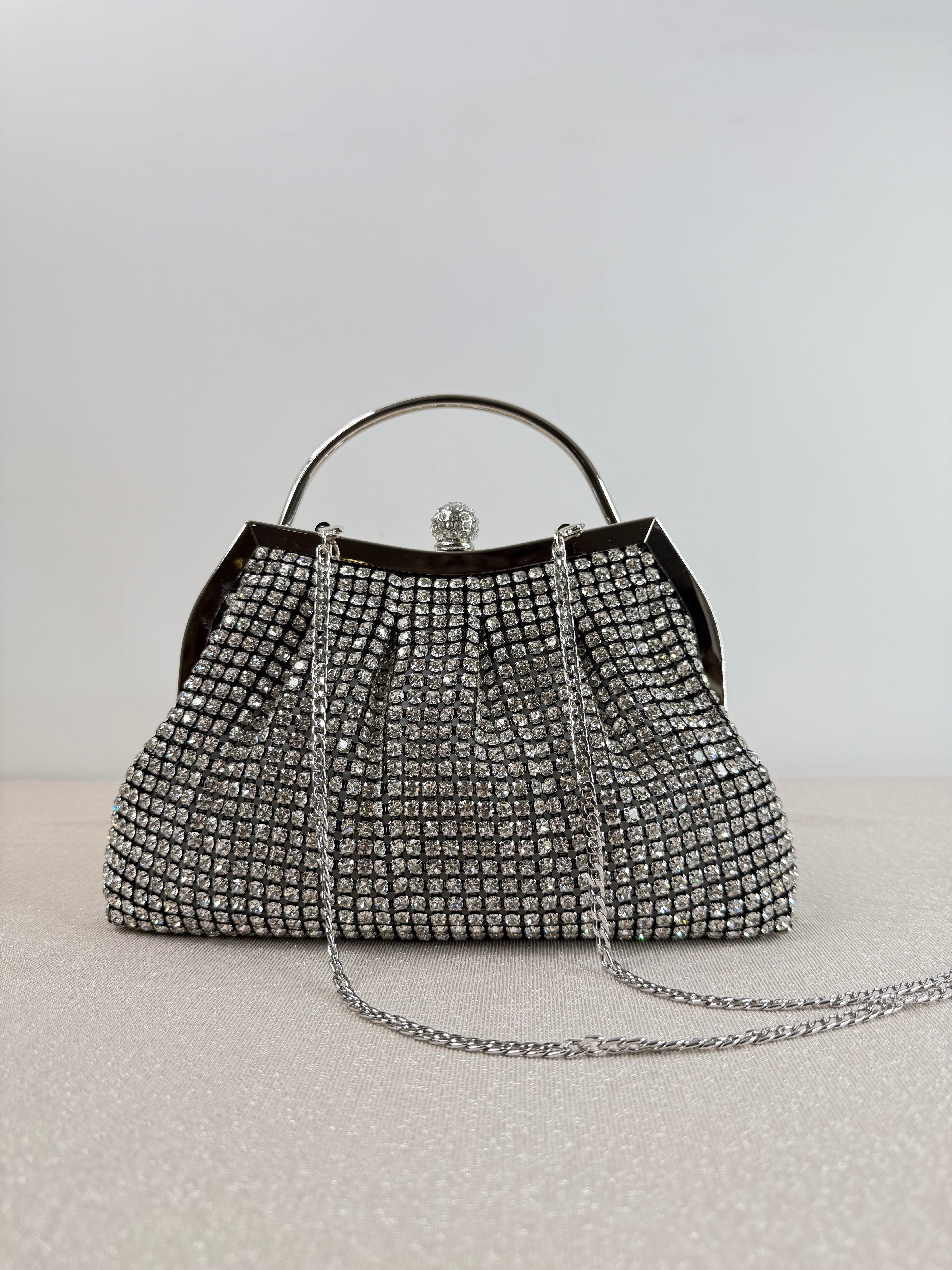 Clutch elegante con manico rigido