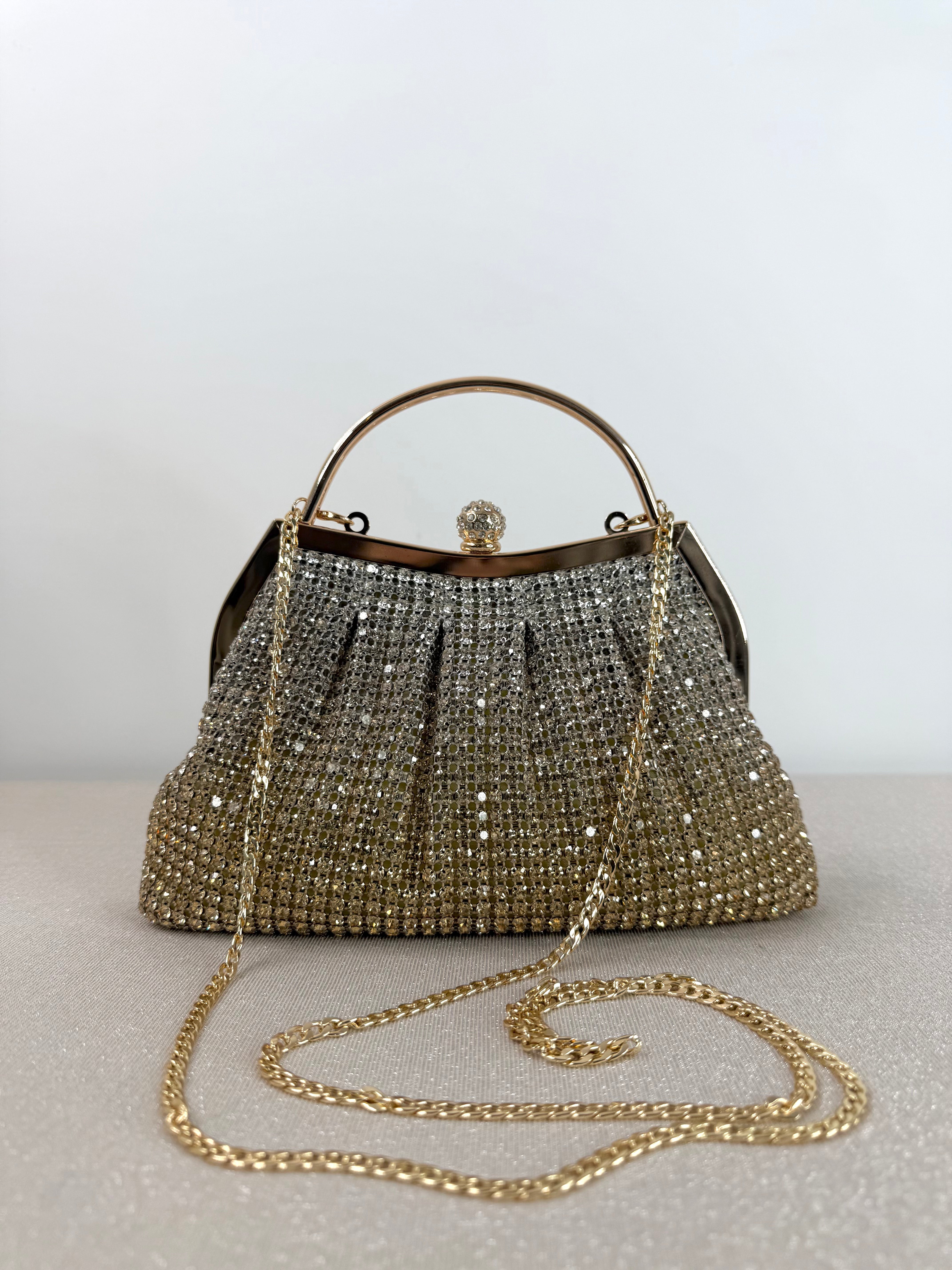Clutch elegante con manico rigido
