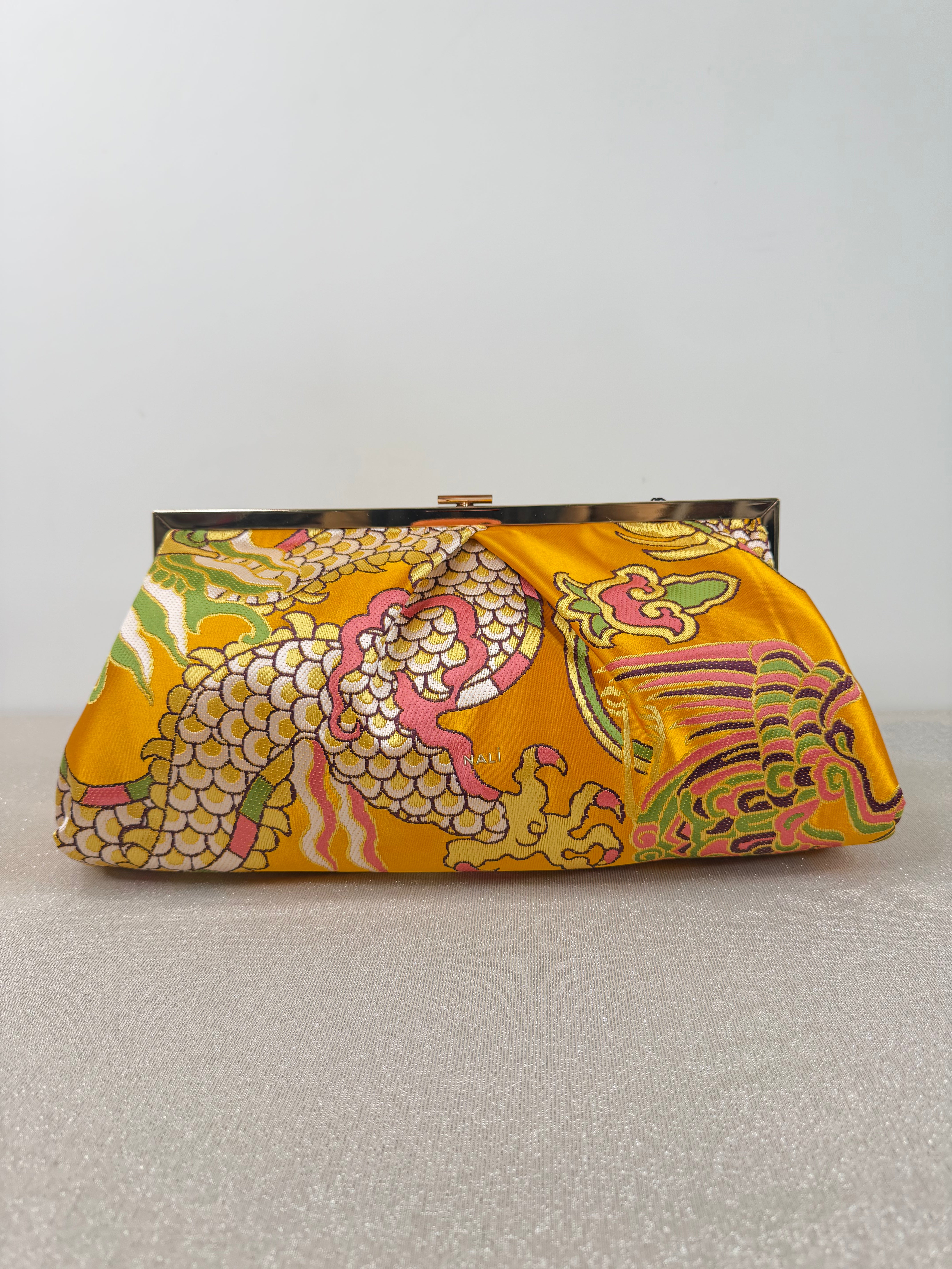 Pochette elegante ricamata con tracolla