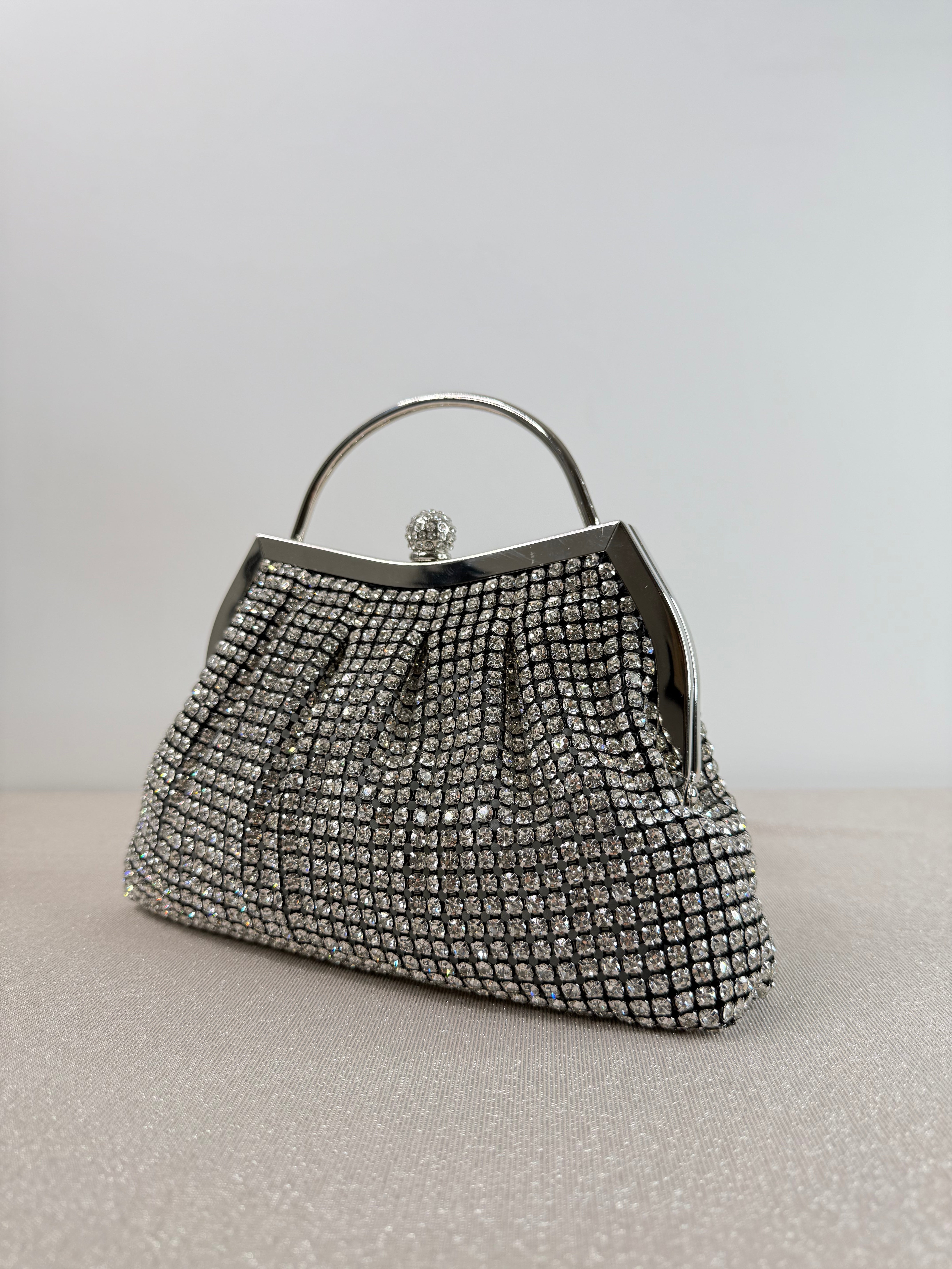 Clutch elegante con manico rigido
