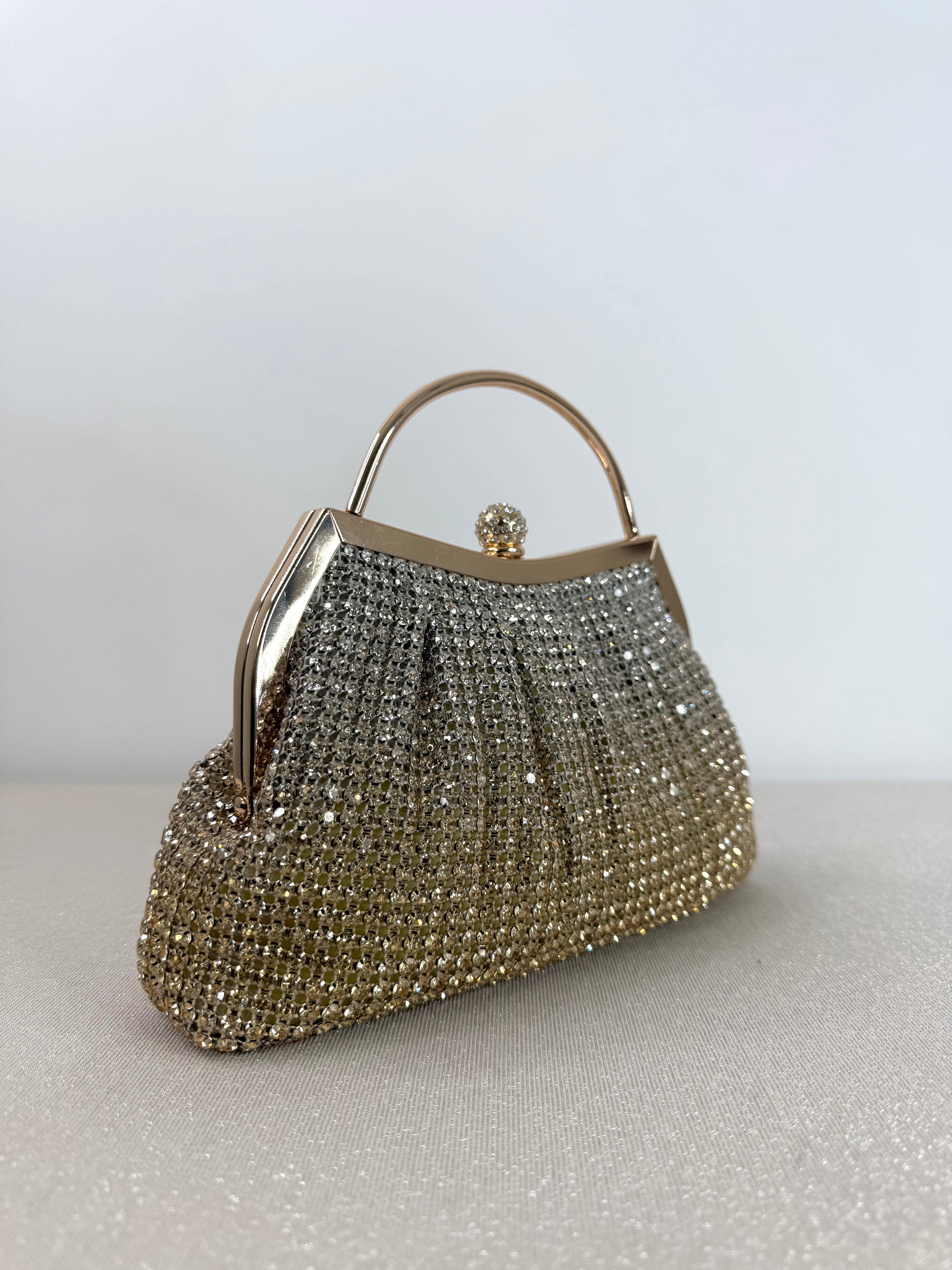 Clutch elegante con manico rigido
